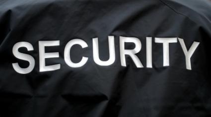 SECURITY, printed on black fabric