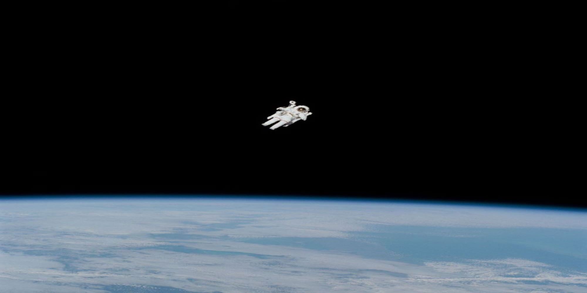 astronaut floating over earth
