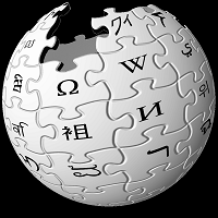 Wikipedia logo. A 3 dimensional globe, made up of white puzzle pieces with black characters.